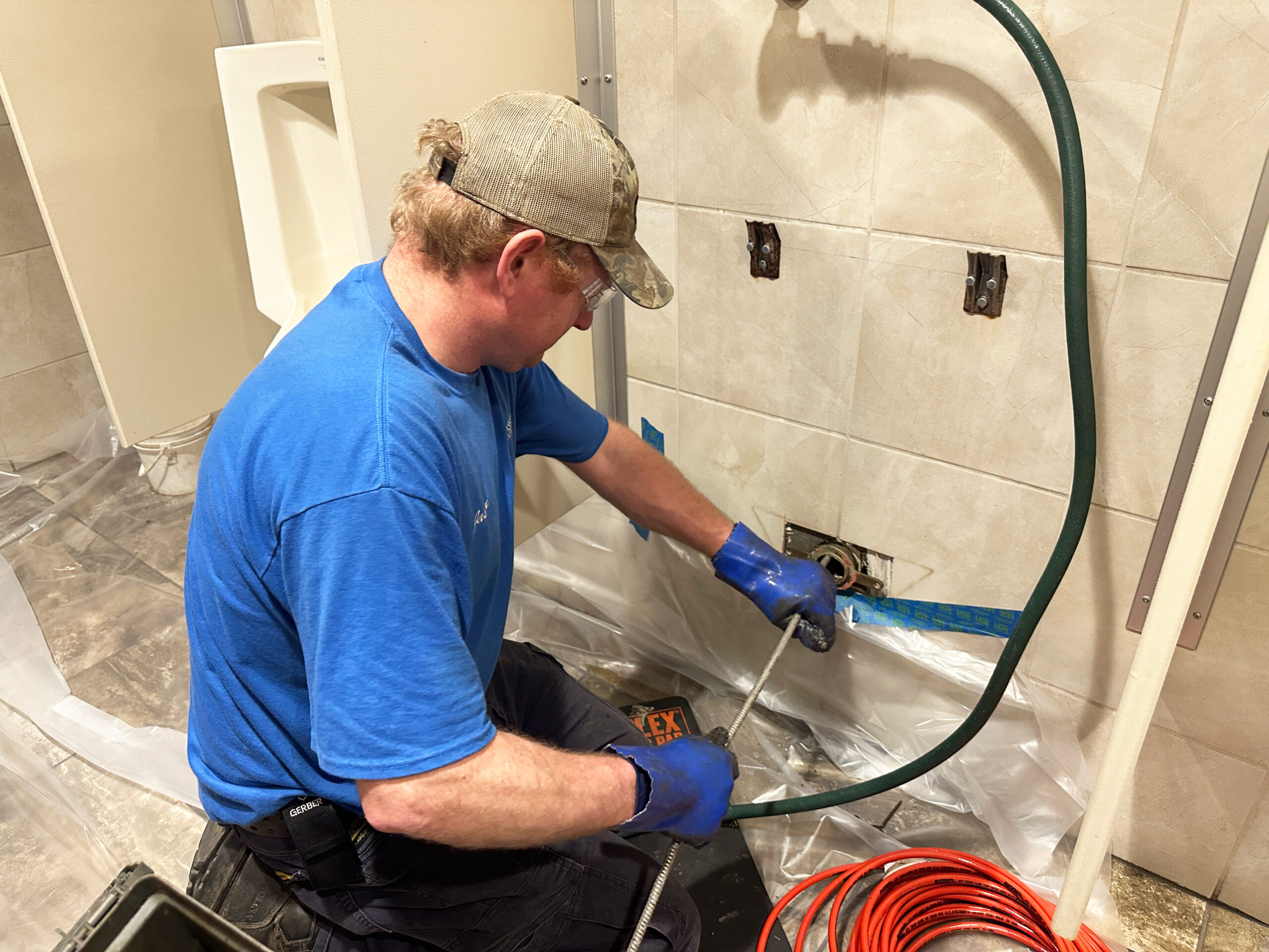 Professional technician installing a new plumbing fixture